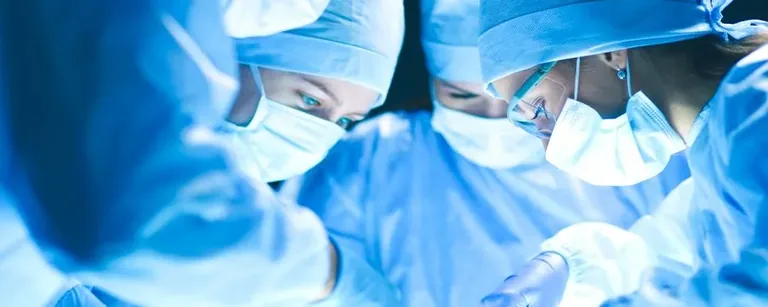 Surgical team operating in theatre